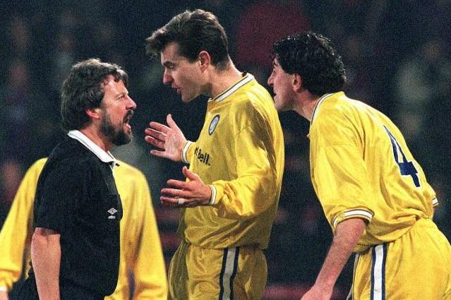 David Wetherall (centre) and Paul Beesley make their point to referee Roger Dilkes after he awarded Crystal Palace a last gasp penalty. PIC: Adam Butler\PA