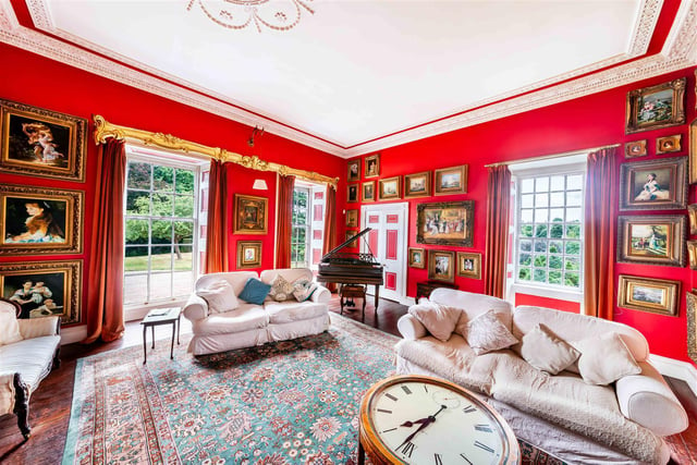 Detailed decoration and large windows with garden views add to the splendour of this lovely reception room.