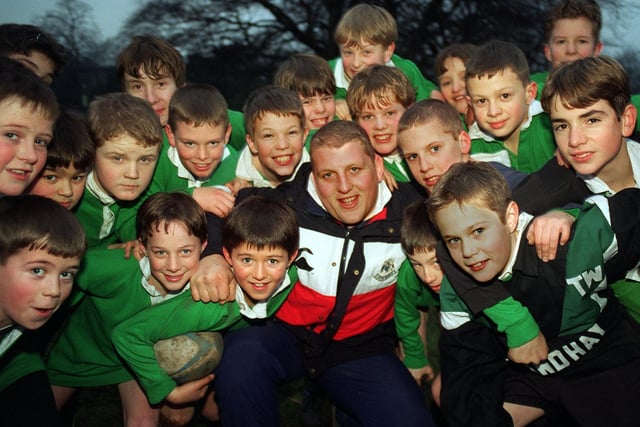 Leeds Rugby Union player Mike Shelley is pictured with pupils from Roundhay High during a training session at the school.