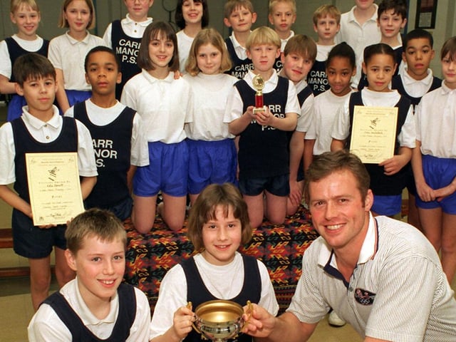 Olympic javelin thrower Mick Hill visited Carr Manor Primary where he presented the school's U-11s athletic team with the Leeds Primary Schools Indoor Athletics championship trophy and awards.