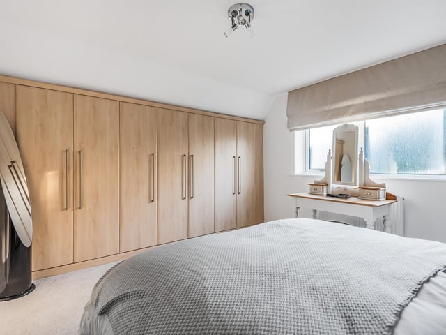 This double bedroom has fitted wardrobes, creating both style and space