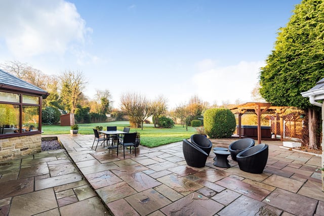 A large patio with views across the garden is perfect for dining out or entertaining