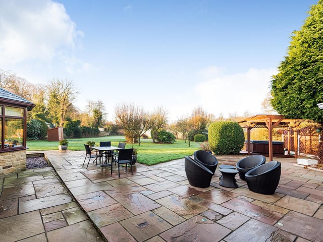 A large patio with views across the garden is perfect for dining out or entertaining
