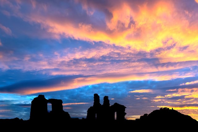 Silhouetted Sandal Castle against an amazing sunset, by Kevin Pearson
