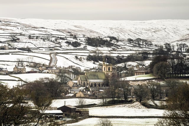 The Grade II listed St Margaret's Church in Hawes, North Yorkshire, sits surrounded by snow covered fields
