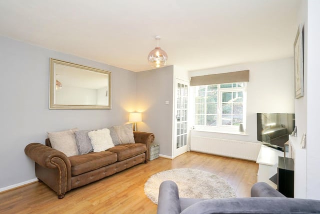 The living room is a bright and cosy space with plenty of room to sit back and relax with family.