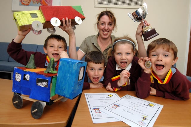 Wood Fold Primary School pupils Hannah, Matthew, Jake and Jonathan, and technology co-ordinator, teacher Sharon Dickinson, celebrate winning 2nd and 3rd places in the Regional Final of the Primary Engineer competition in 2008