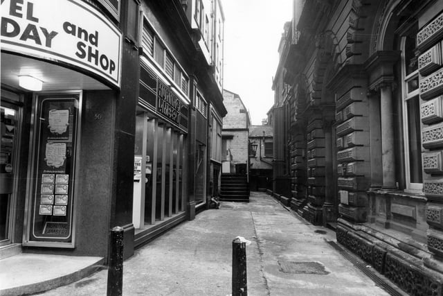 The entrance to Change Alley in Leeds city centre pictured in April 1983. Hunting Lambert travel agency can be seen on the left.