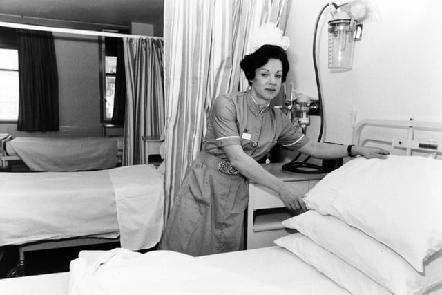 Ward sister Anne-Marie Butterfield prepares a bed for her first patient at the newly opened Clarendon Wing at Leeds General Infirmary in November 1983.