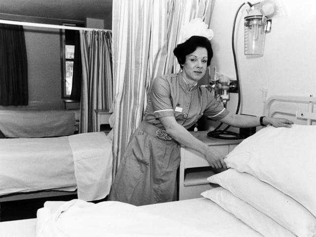 Ward sister Anne-Marie Butterfield prepares a bed for her first patient at the newly opened Clarendon Wing at Leeds General Infirmary in November 1983.