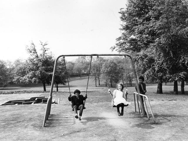 Children playing on the newly installed swings in Potternewton Park. The swings were part of a scheme to improve the park which included other safe and modern play equipment. Other improvements included renovations to the old tennis courts to provide three new ones, two basketball courts and a hard surface for five-a-side football.