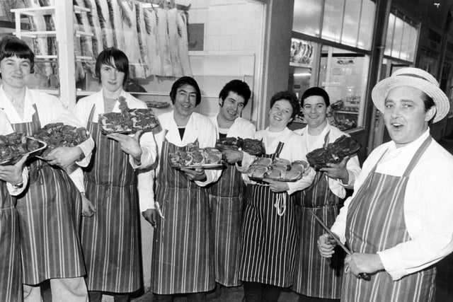 Storms brought an unexpected bonanza to shoppers in Kirkgate Market in February 1983. Butcher Trevor Middleton, thinking his shops might be closed because of the damage cut his prices 'to the bone' and gave away vegetables with the meat. He is pictured with  staff, from left, Brian Longbottom, Christopher Farmer, Roy Marsden, Colin Clark, Jackie Morgan and Graham Wray.