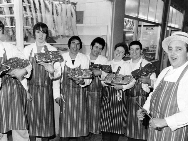 Storms brought an unexpected bonanza to shoppers in Kirkgate Market in February 1983. Butcher Trevor Middleton, thinking his shops might be closed because of the damage cut his prices 'to the bone' and gave away vegetables with the meat. He is pictured with staff, from left, Brian Longbottom, Christopher Farmer, Roy Marsden, Colin Clark, Jackie Morgan and Graham Wray.