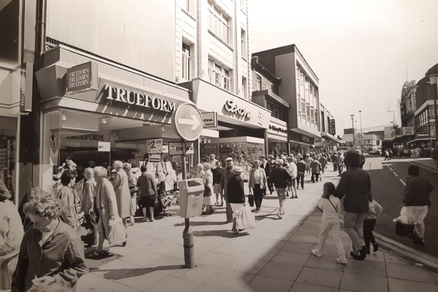 This was a busy scene in July 1987, again on Church Street at the bend which turns into Coronation Street. More shoe shops - Trueform and Saxone
