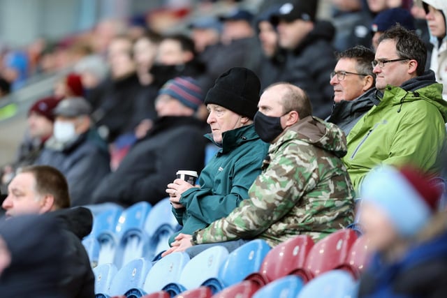 Burnley fans anxiously watch the second half action