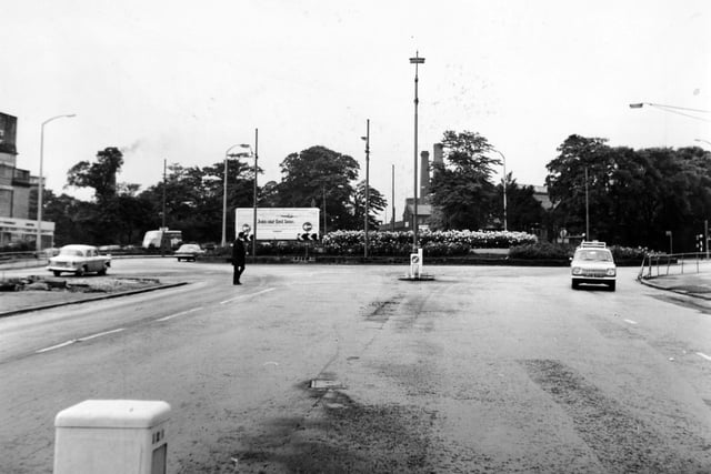 A pedestrian negotiates crossing Stanningley Road at Bramley Town End in July 1970. There were plans to install a zebra crossing.