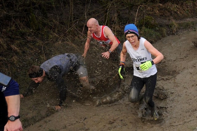 Some runners struggled to maintain their footing as they battled through the mud.