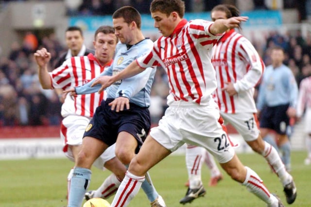 David Healy is outnumbered by Stoke City's Gifton Noel-Williams and Lewis Buxton.