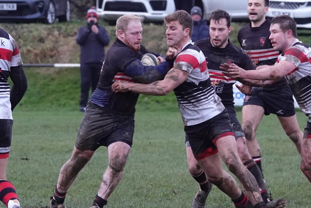 Old Brodleians' Michael Briggs meets the Ilkley defence. Picture: Robin Sugden