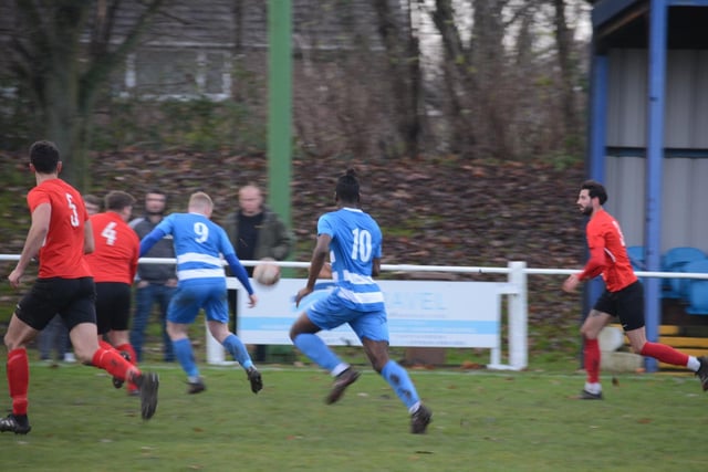 Glasshoughton Welfare centre-forward James Cusworth looks to get in behind the Parkgate defence.