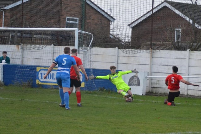 Glasshoughton Welfare goalkeeper Joshua Wright spreads himself well to make a big save.