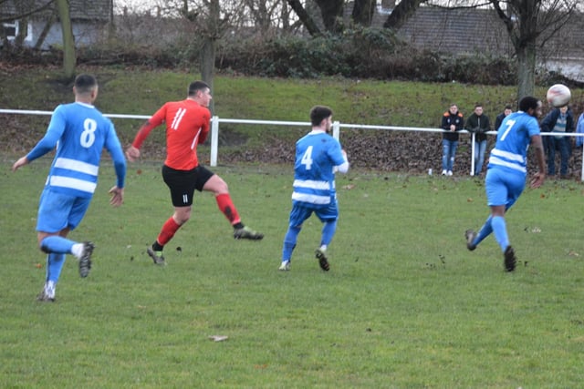 Glasshoughton Welfare's Fidel Mholo tries to block a Parkgate clearance.