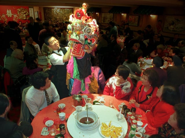 Members of the Leeds Chinese Community celebrate the New Year at the Lucky Dragon restaurant.