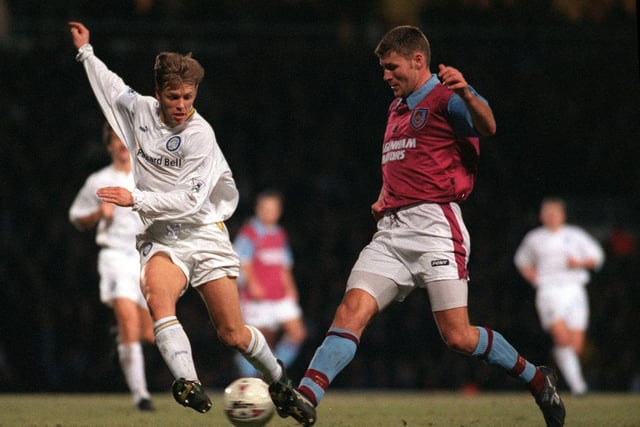 Gunnar Halle goes flying in to challenge West Ham United's Marc Rieper.