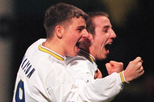 Lee Bowyer celebrates scoring Leeds United's second goal with Mark Jackson. PIC: Fiona Hanson/PA