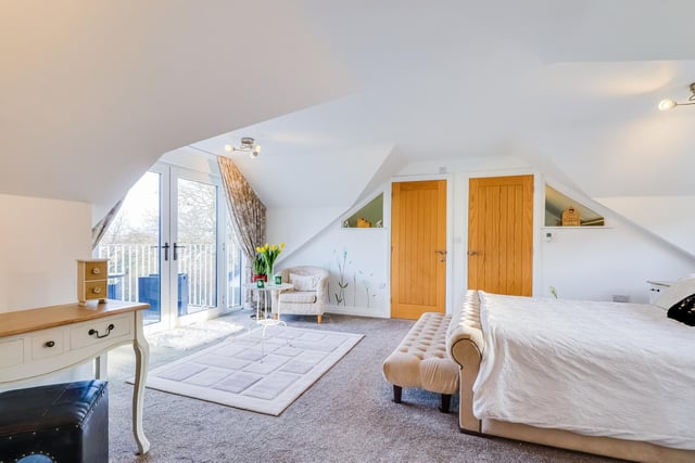 This double room has its own balcony overlooking countryside, two walk-in wardrobes and an en suite bathroom.
