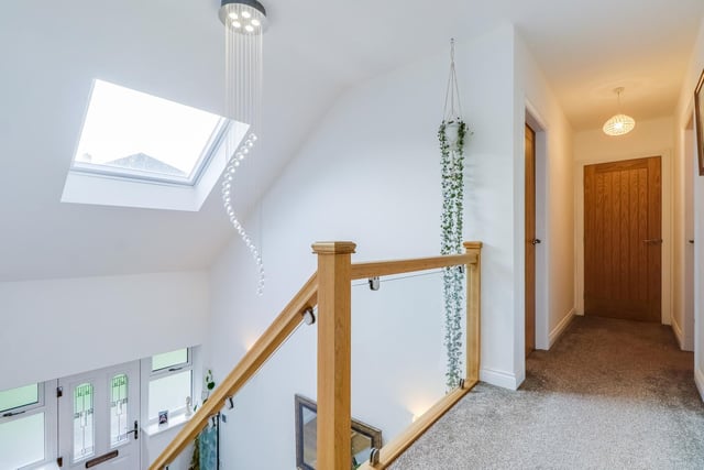 Windows and skylight ensure natural light covering the staircase and landing.