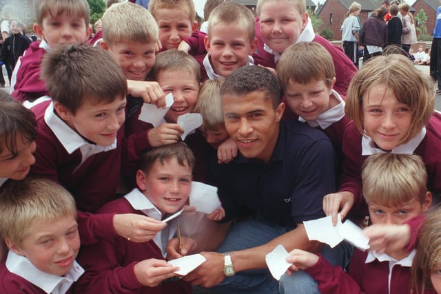Jason Robinson signs autographs at his old school in Hunslet Carr in June 1998.