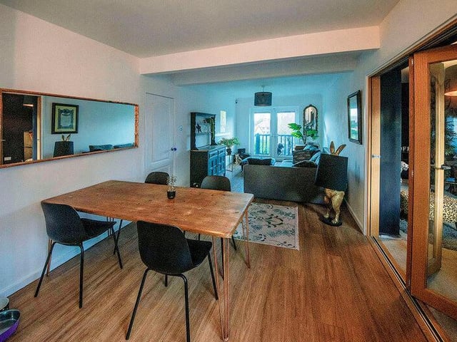 There is plenty of space for a family dining table, perfect for sitting and enjoying a meal. Bi-fold doors seamlessly connect this space with the rest of the house.