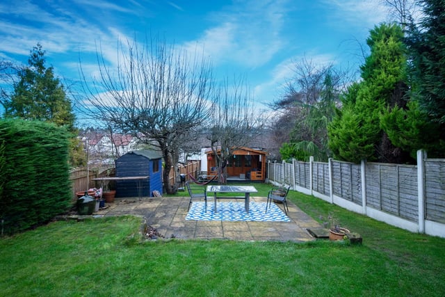 Outside is a large garden with views across Roundhay. It has plenty of lawned space, as well as a patio and two sheds.