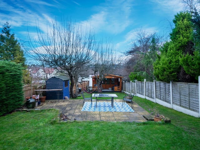 Outside is a large garden with views across Roundhay. It has plenty of lawned space, as well as a patio and two sheds.