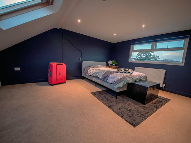 Upstairs, a double dormer has been added to create two large bedrooms.