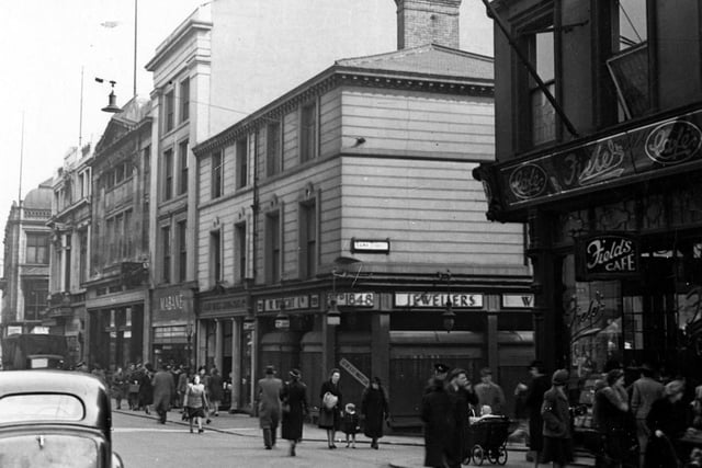 Commerical Street in April 1945. This view is at the junction with Bank Street. Field's cafe can be seen on the right opposite W. Wright jewellers shop.