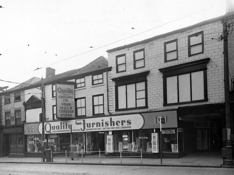 Shops on Kirkgate in October 1948. They include W. & G. Scott Provision Merchant, and Quality Furnishers Ltd. The block was between the Fox and Grapes Yard and Crown Court.