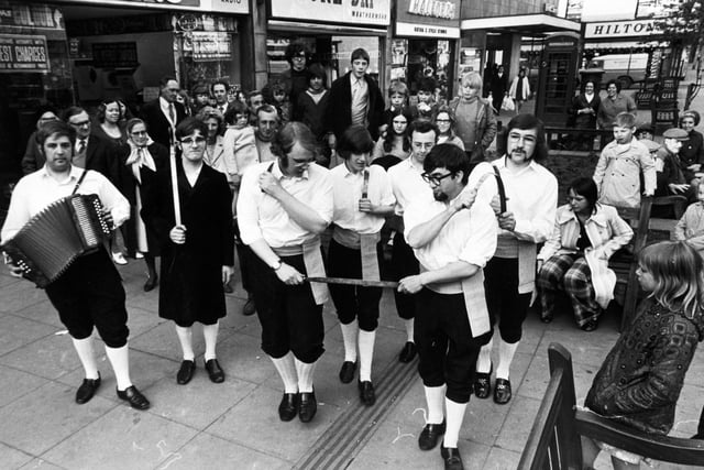 Members of the Castleford Long Sword and Rapper Dancers entertain shoppers in Carlton Street, Castleford.