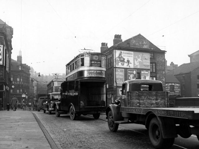 Briggate over Leeds Bridge in November 1949. On the left is H. Wigfall & Son Ltd., furnishers on Bridge End. Further along on Briggate is The Golden Lion Hotel.