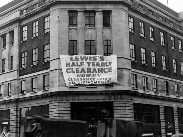 The south west corner of Lewis's department store on The Headrow in July 1947. 'Clearance' poster visible.