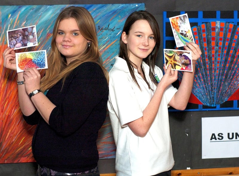 Lucy Williamson and Charlotte Miller show off their postcard designs.
