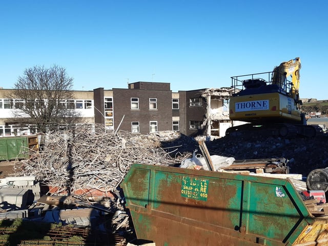 A large part of the old hospital building is now rubble.