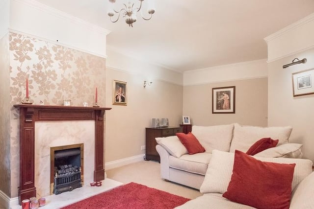 A cosy sitting room, again with a fireplace as its central feature.