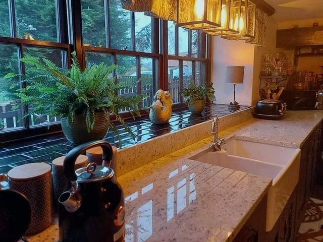 Large windows allow natural light to flood in to the kitchen but also provide a lovely outlook, while standing at the sink and worktops.