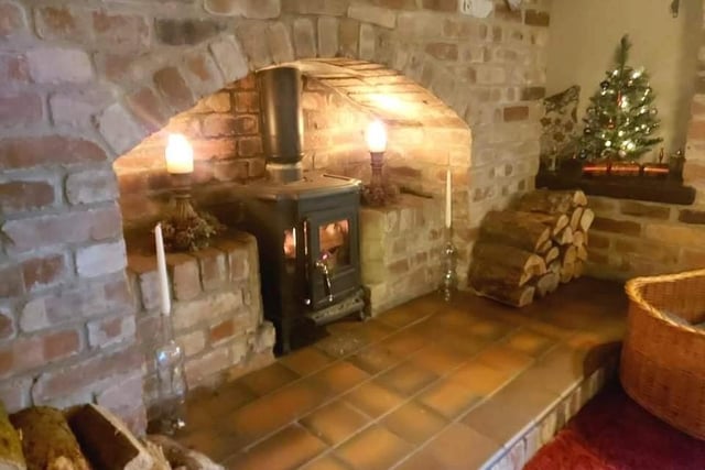 One of the feature fireplaces within one of the property's reception rooms.