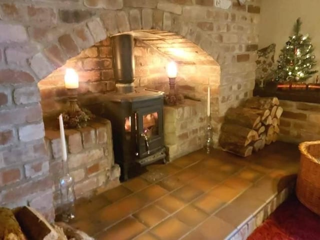 One of the feature fireplaces within one of the property's reception rooms.