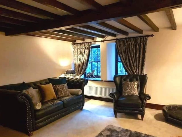 This beamed room is typical of the characterful property.