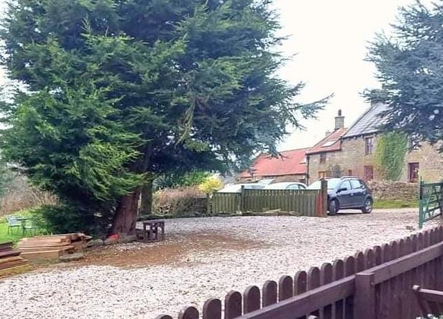 This property comes with gardens, land and stabling suitable for horses, and additional outbuildings.