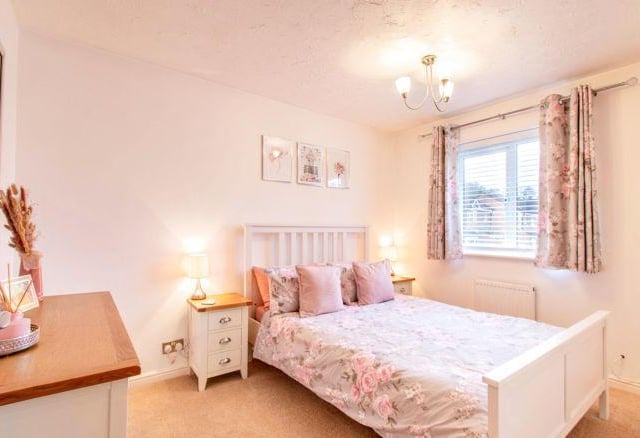 The second bedroom has a similar colour scheme and is a good sized room.